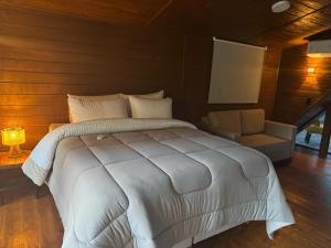 Postel nebo postele na pokoji v ubytování AR Pousada