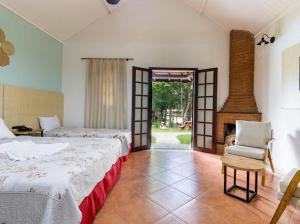 Postel nebo postele na pokoji v ubytování Hotel Fazenda