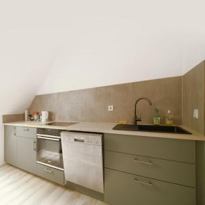 Kuchyň nebo kuchyňský kout v ubytování Landnest + 8 fotografií