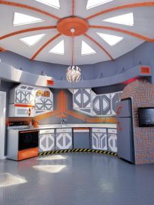 a room with a kitchen with a ceiling with windows at The Spaceship House! in Navarre