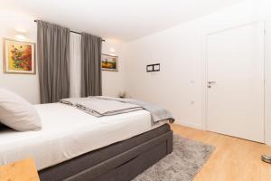 Postel nebo postele na pokoji v ubytování Bogdanović Winery Apartman