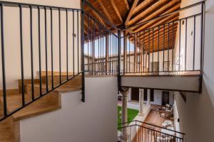 an overhead view of a building with a wooden ceiling at La Casa de la Botica - Casa Rural El Romeral in Romeral