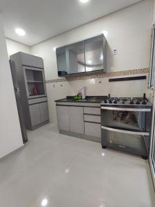 Køkken eller tekøkken på Rio Grande Apartamento