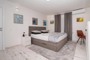 Postel nebo postele na pokoji v ubytování Bogdanović Winery Apartman