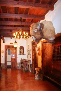 a room with a stuffed animal hanging from the ceiling at Hotel y restaurante Cuenca Antigua in Mazamitla