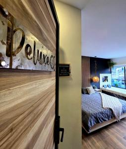 Postel nebo postele na pokoji v ubytování Habitacion Deluxe 2 con Jacuzzi a 20 mt del parque