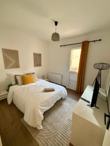 En eller flere senge i et værelse på Duplex Art & Détente Centre ville