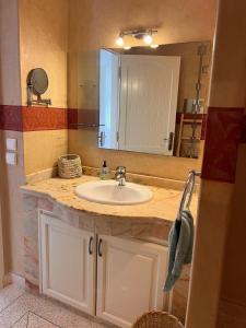 a bathroom with a sink and a large mirror at Villa avec vues sur dunes, montagnes et océan! Accès plage direct! Proche SIDI BOULFDAIL et AGLOU in Tamellalt +31 photos