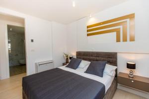 Postel nebo postele na pokoji v ubytování Villa 21 B