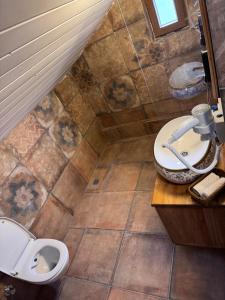 a bathroom with a toilet and a sink at Keyfe Kadir Garden Butik Otel in Orhangazi +29 photos