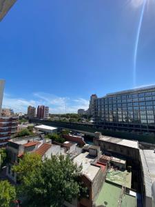 a view of a city with a tall building at Espacio Arena in Buenos Aires
