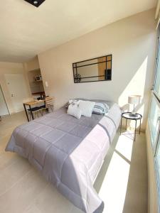 a bedroom with a large bed in a room at Espacio Arena in Buenos Aires