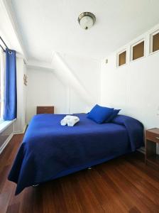 Una cama o camas en una habitación de La Galería B&B