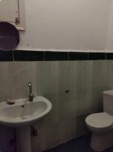 a bathroom with a sink and a toilet at LUKA House in Dahab