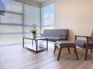 a living room with a couch and a table and chairs at Studio Suite - 5 Min Walk to Crypto Arena and Convention Center in Los Angeles