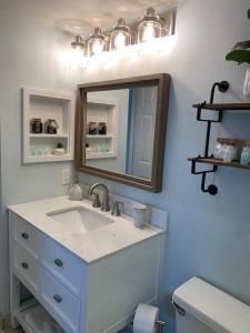 a bathroom with a sink and a mirror at Ocean Pointe Resorts 3410 Boho in Tavernier +33 photos