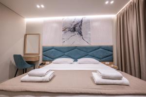 Postel nebo postele na pokoji v ubytování Koko Hotel