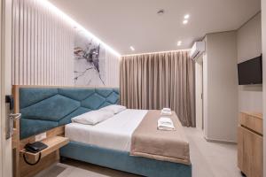 Postel nebo postele na pokoji v ubytování Koko Hotel