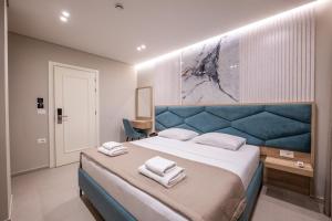 Postel nebo postele na pokoji v ubytování Koko Hotel