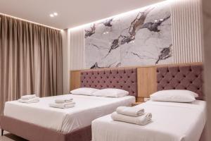 Postel nebo postele na pokoji v ubytování Koko Hotel
