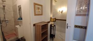 a bathroom with a shower and a walk in shower at Appartement Jardin et Spa in Valras-Plage +35 photos