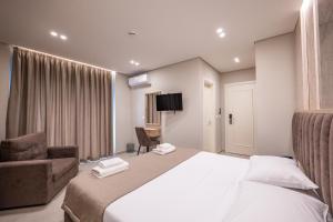 Postel nebo postele na pokoji v ubytování Koko Hotel