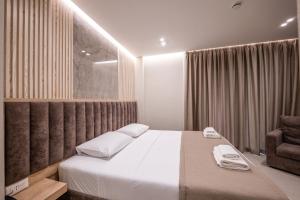 Postel nebo postele na pokoji v ubytování Koko Hotel