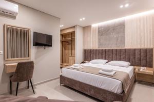 Postel nebo postele na pokoji v ubytování Koko Hotel