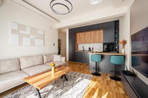 a living room with a couch and a table at Cozy Coastal Bliss 2 in Ulcinj