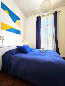 Una cama o camas en una habitación de La Galería B&B