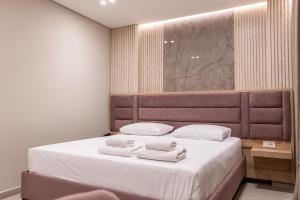 Postel nebo postele na pokoji v ubytování Koko Hotel