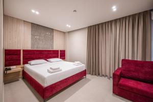 Postel nebo postele na pokoji v ubytování Koko Hotel
