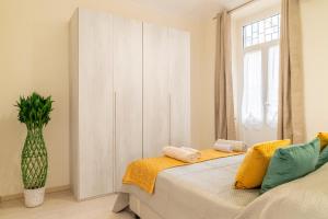 a bedroom with a bed with two towels on it at Residenza Spezia - Hospitals, Lingotto & Metro in Turin