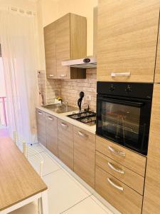 O bucătărie sau chicinetă la Dodo Holiday in Rome