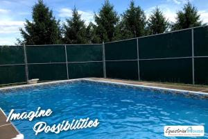 a swimming pool in a backyard with a fence at Home Away From The City - Premium Suite Andalusian- 35 Off Promo! in Pleasant Mount