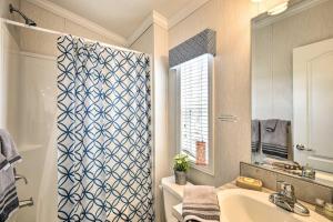 a bathroom with a sink and a shower curtain at Master Complex 12 Br Estate Experience 100 Acre in Pleasant Mount +33 photos