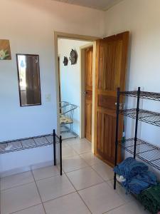 a room with two bunk beds and a door at Recanto Santa Helena Iriri Santa Helena in Anchieta