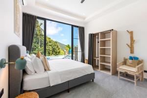 a bedroom with a bed and a large window at VILLA CAMILLE - SEAVIEW - 4 Bedrooms in Koh Samui  +93 photos