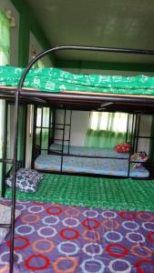 Ένα ή περισσότερα κρεβάτια σε δωμάτιο στο Fishermen's Den dorm