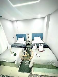 Krevet ili kreveti u jedinici u objektu Pyramids View R Z Hotel