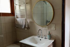 a bathroom with a sink and a mirror at Casa Tinta in San Carlos de Bariloche +25 photos