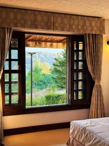 Postel nebo postele na pokoji v ubytování Baan View Doi - Mountain Retreat