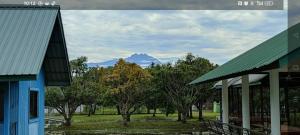 a view of a mountain in the distance from a building at FZ Tuaran Country Village in Tuaran