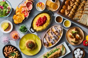 a table with many different dishes of food on it at Kyoto Tower Hotel Annex in Kyoto