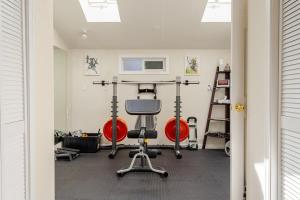 a room with a gym with a treadmill at Cozy and Relaxing Private Getaway Full Amenities in Bellingham