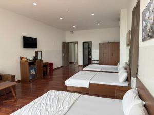 Postel nebo postele na pokoji v ubytování NGOC PHUNG HOTEL
