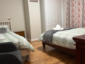 Voodi või voodid majutusasutuse Cobh Holiday Home toas