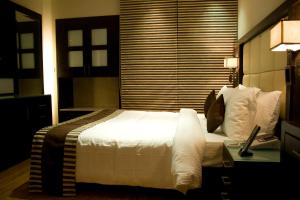 Postel nebo postele na pokoji v ubytování Hotel La Abode