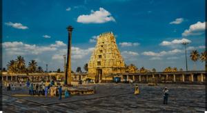 a group of people standing around a large temple at Rooms & Food Sri Ranga in Belūr