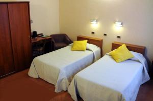Postel nebo postele na pokoji v ubytování Hotel Button
